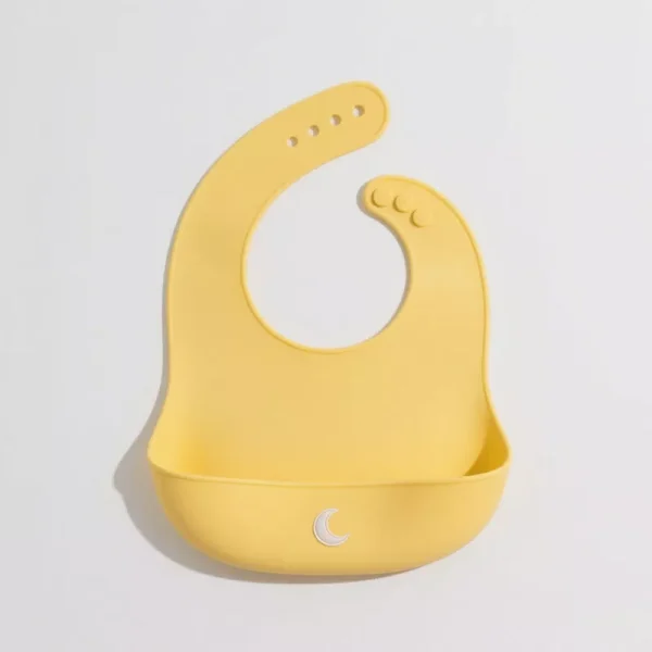 Yellow silicone baby bib with food catcher and moon icon