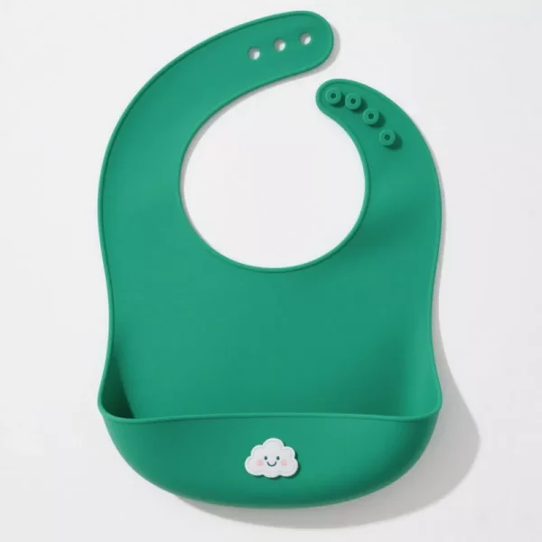 Green silicone baby bib with food catcher and smiling cloud design