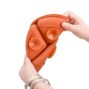Hands bending orange silicone suction plate to show flexibility