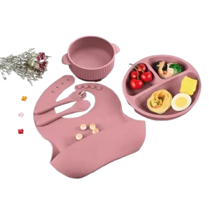 Pink Silicone Toddler Meal Set – Bib, Bowl, Spoon, and Suction Plate Isolated on Transparent Background