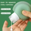 Green silicone travel bottle dispensing lotion smoothly, designed for effortless squeezing and consistent flow