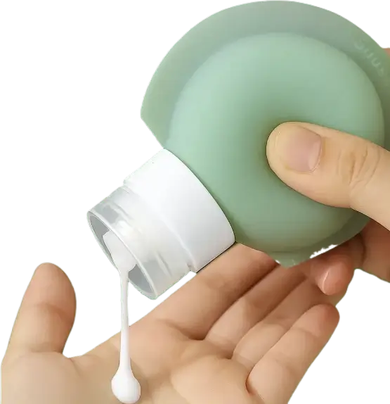 Squeezable silicone travel bottle dispensing lotion into hand, ideal for toiletries and airport-friendly containers
