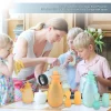 Family using colorful silicone feeding pouches in kitchen setting.