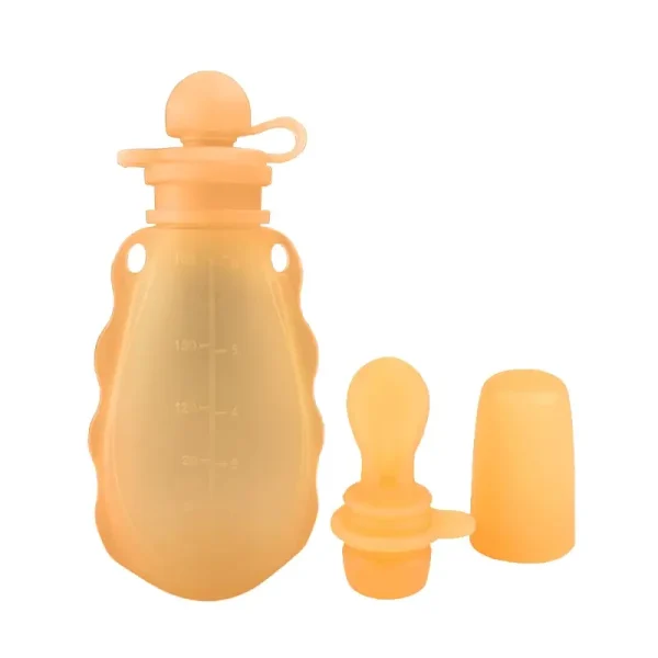 Orange silicone baby food pouch with spoon and cap.
