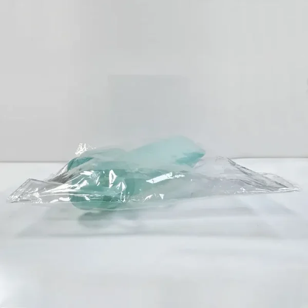 Silicone baby feeding pouch packed in a transparent polybag.