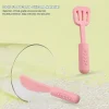 Pink silicone cookware play set with pot, pan, utensils, and bottle.