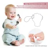 Ergonomic Baby Training Utensils Smiling baby holding training spoon and fork with ergonomic handles.