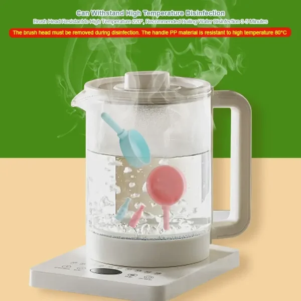 Silicone cookware play set in pink, featuring pot, pan, utensils, and accessories.