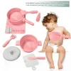 Pink silicone cookware play set with pot, pan, utensils, and bottle.