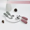 Baby Feeding Utensil Set Display Two sets of baby spoons and forks with green and pink handles displayed on a plate.