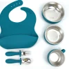 Gray silicone feeding set with stainless steel bowls and baby bib. Gray silicone toddler meal kit with bib, bowls, cup, spoon, and fork.