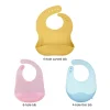 Set of three silicone baby bibs in yellow, pink, and blue.